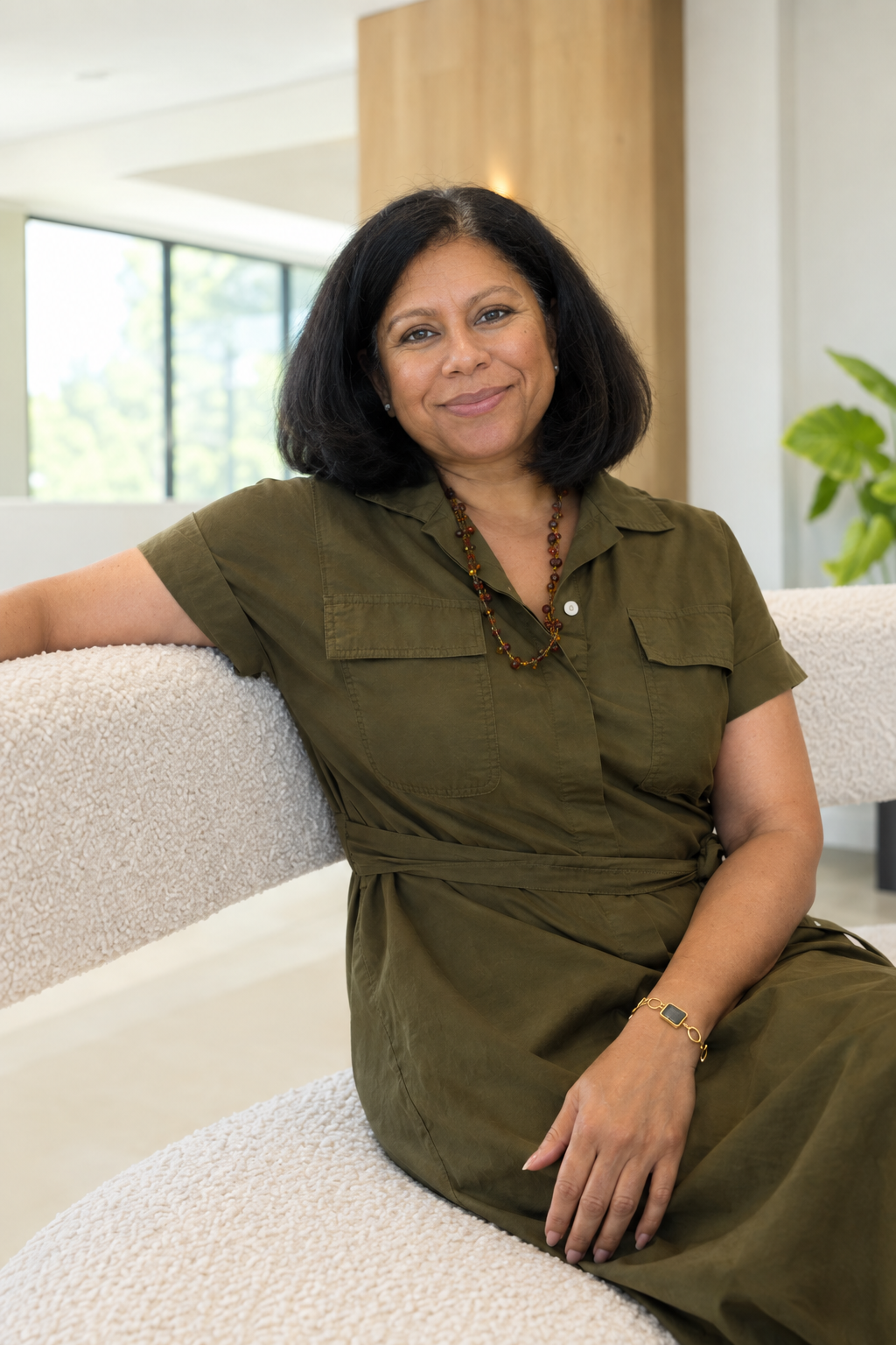 Dr. Seema Shah seated in a light-filled space.